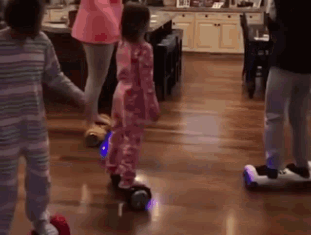 a group of children are playing in a living room .