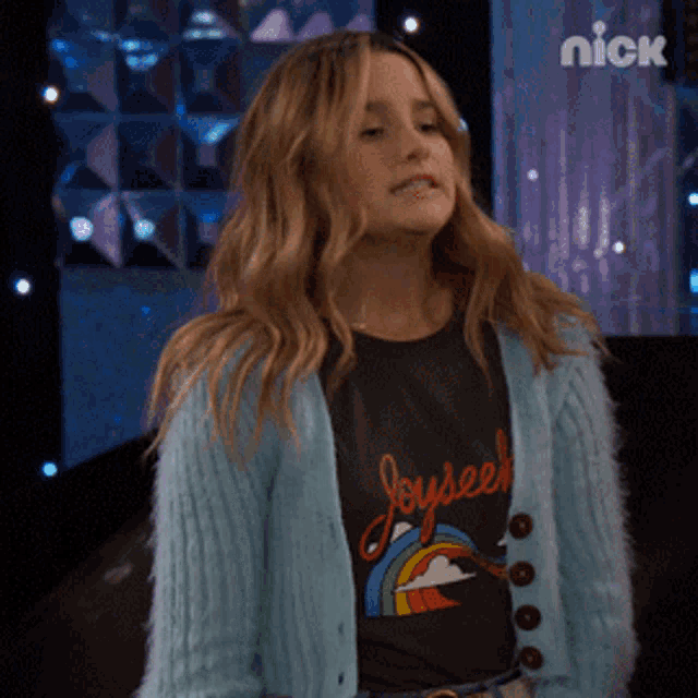 a girl wearing a black shirt that says joyseek