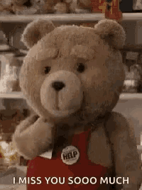 a teddy bear is wearing a red apron and saying `` i miss you sooo much `` .