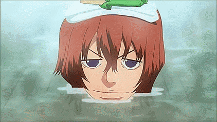 a close up of a person 's head in the water with a hat on .