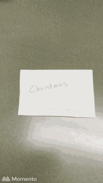 a piece of paper with christmas written on it