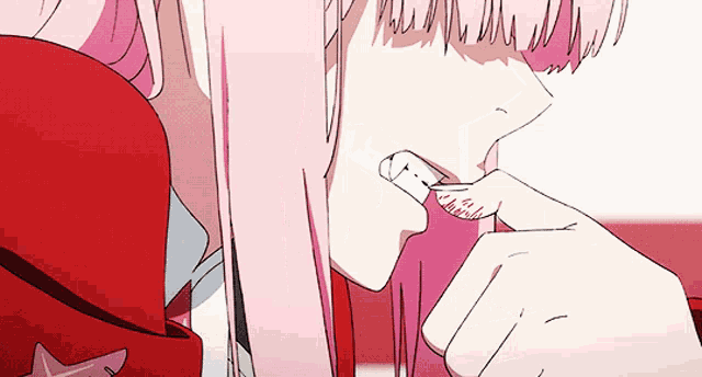 a close up of a girl with pink hair holding a toothbrush