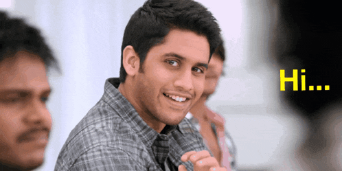 a man in a plaid shirt is smiling and the word hi is visible behind him