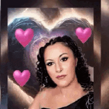 a woman in a black dress with pink hearts around her