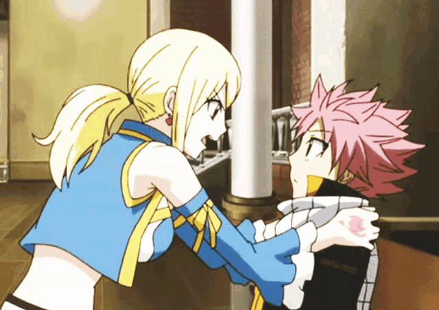 a boy and a girl are standing next to each other in a room