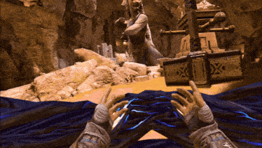 a screenshot of a video game with a statue in the background and a box that says ' x ' on it