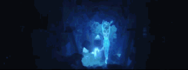 a blue light is shining on a dark background