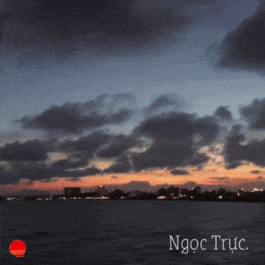 a sunset over a body of water with the words ngoc truc