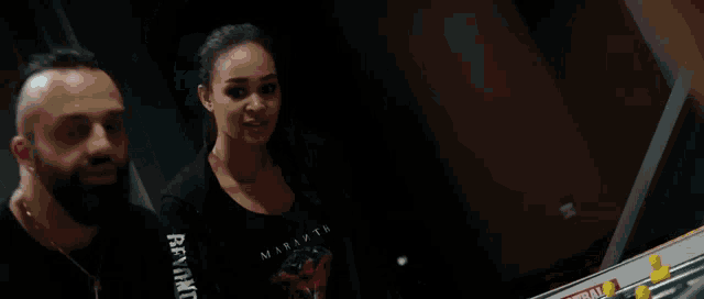 a woman in a black shirt with the word miami on the sleeve