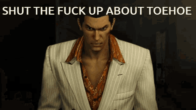 a man in a suit is standing in front of a sign that says shut the fuck up about toehoe