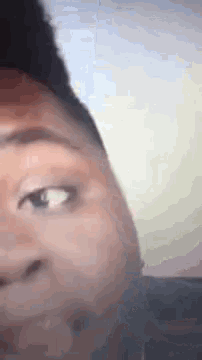 a close up of a person 's face with their eyes closed .