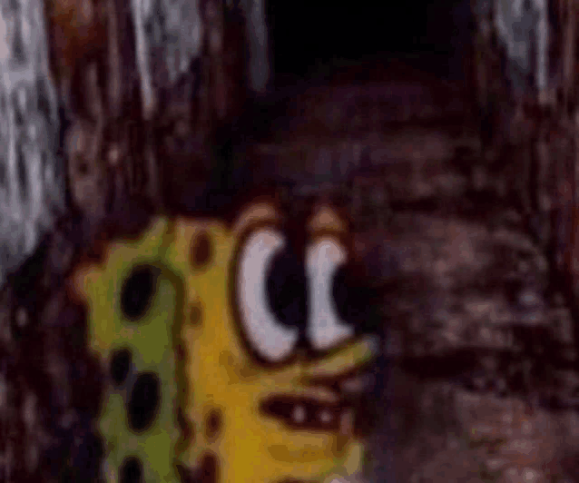 a spongebob squarepants character is standing in a dark room .
