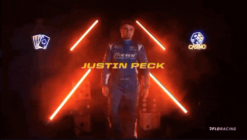 a person holding a helmet with the name justin peck on it
