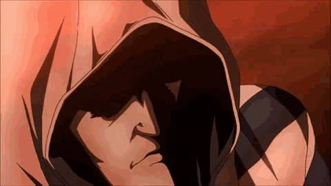 a close up of a person 's face with a hood on their head
