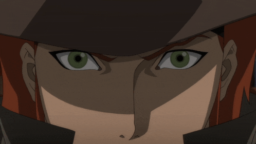 a close up of a cartoon character 's face with green eyes