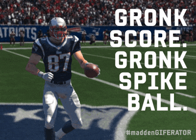 a football player is running on a field with the words gronk score gronk spike ball above him