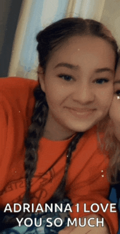 a girl in a red shirt says adrianna 1 love you so much