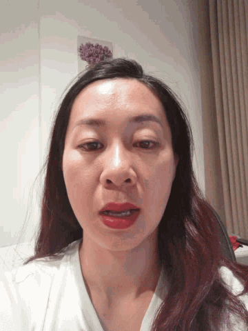 a close up of a woman 's face with red lips
