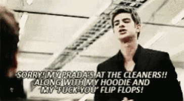 a man in a black suit is saying sorry my prada sat the cleaners