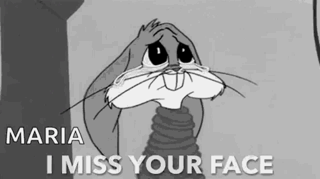 bugs bunny is crying in a black and white cartoon and saying `` i miss your face '' .
