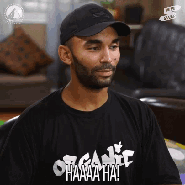 a man wearing a black shirt that says organic haaaa ha!