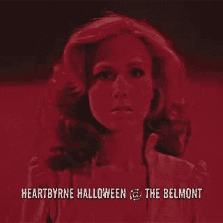 a woman is screaming in a red background with the words heartbyrne halloween at the belmont on the bottom