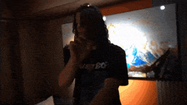 a man wearing a shirt that says nasty boy on it