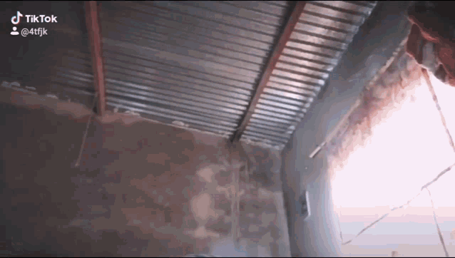 a room with a metal roof and a tiktok watermark