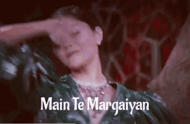 a woman covering her face with her hand and the words main te margaiyan written below her
