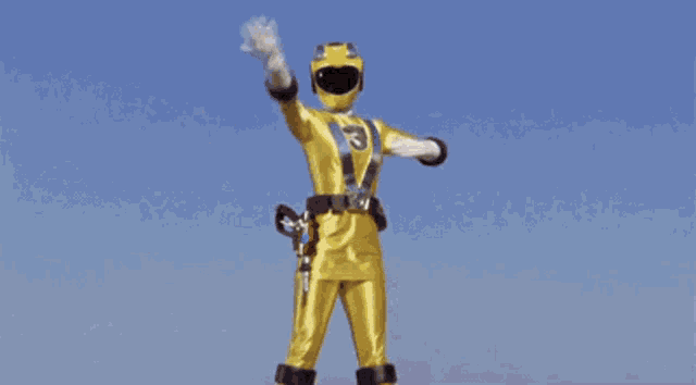 a yellow power ranger with the number 3 on his belt