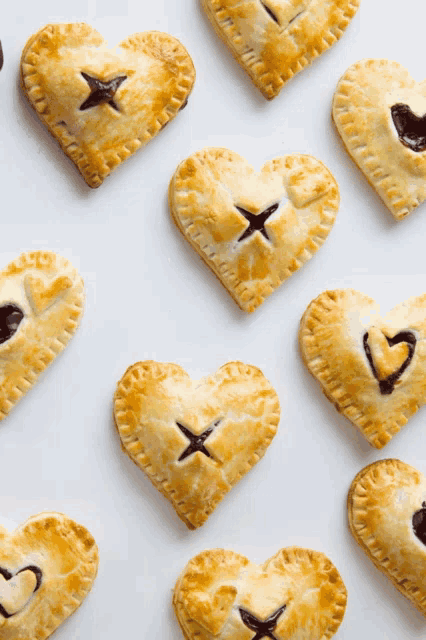 a heart shaped pastry with a star and a heart drawn on it