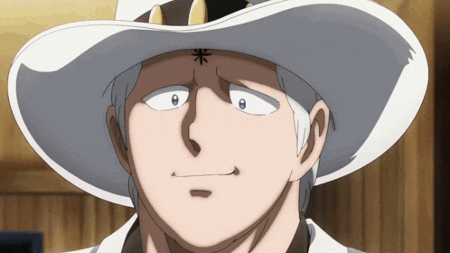 a man wearing a white cowboy hat with a black star on his forehead