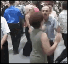 a group of people are dancing in a crowd with 4gifs.com at the bottom of the screen