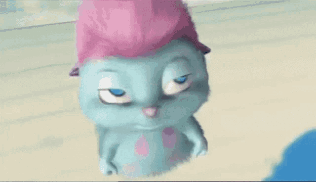 a close up of a cartoon character with blue eyes and a pink hairdo .