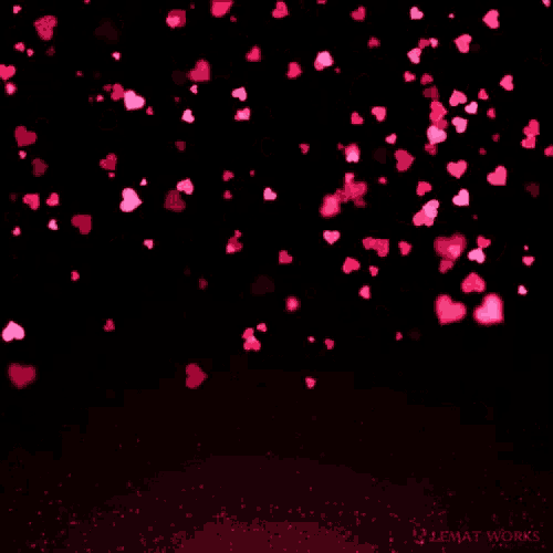 a bunch of pink hearts falling on a black background that says ultimate works