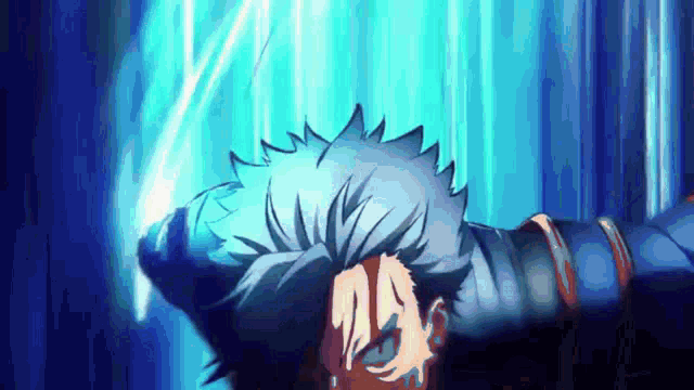 a person is laying down with their head in their hands and a blue background .