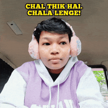 a man wearing ear muffs and a purple sweatshirt with the words chal thik hai chala lenge written above him