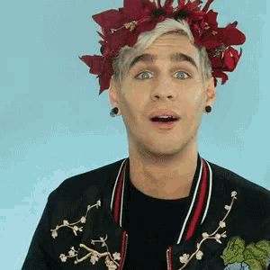 a man wearing a flower crown on his head