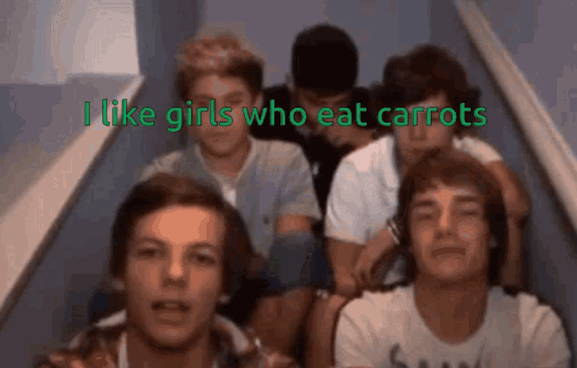 a group of young men are sitting on a staircase with the words " i like girls who eat carrots " below them