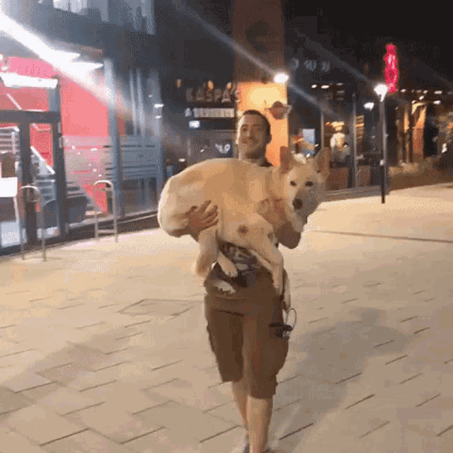 a man carrying a large dog on his shoulders in front of a kaspa 's restaurant