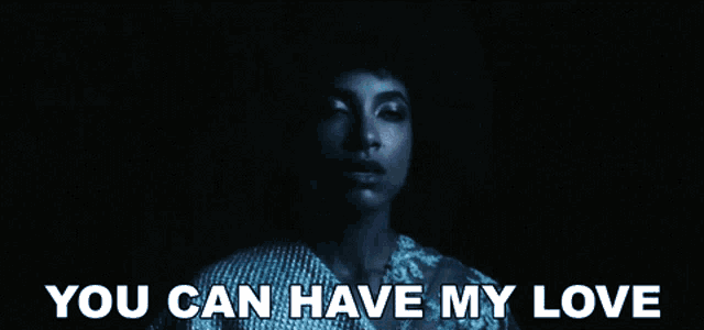 a woman in a dark room with the words " you can have my love " above her
