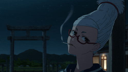 a woman with glasses is smoking a cigarette