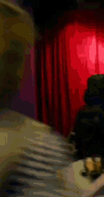 a close up of a yellow object on a table with a red background