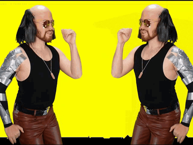 two bald men are standing next to each other with their arms up
