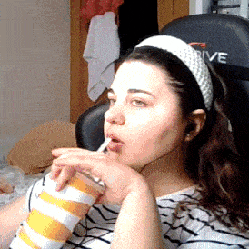 a woman drinking from a cup with the word rive on it