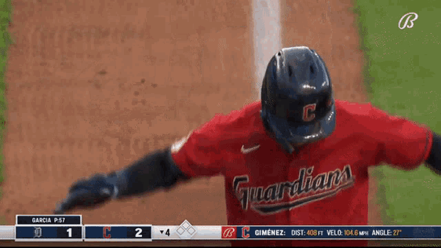 a baseball player wearing a red jersey that says guardia on it