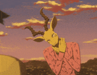 a man in a pink shirt and black pants is standing in the sand