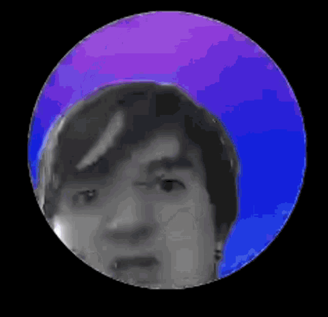 a man 's face is shown in a circle with a purple and blue background .
