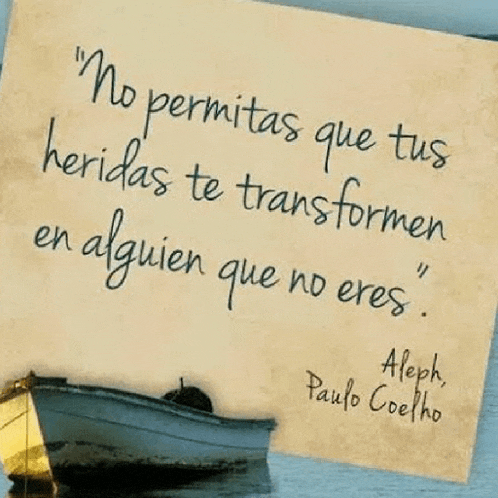 a quote by paulo coelho is on a piece of paper next to a boat .