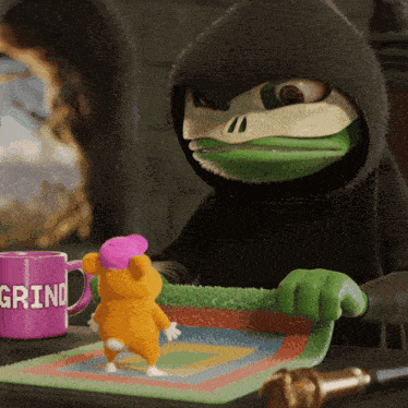 a purple mug that says grind sits on a table next to a stuffed animal